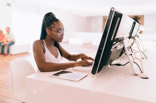 Preview: skilled teenager in spectacles using high technology for research connected to internet