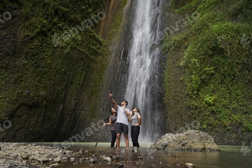 Preview: small group of young asian indonesian man and woman taking selfie photos