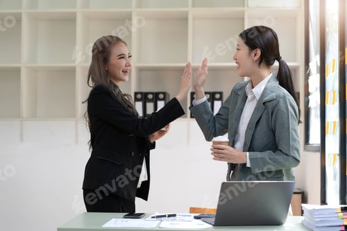 Preview: Young Asian business team creative businesspeople coworker in office Happy to be successful