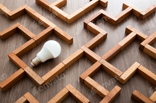 Preview: Light bulb in the maze game built by wood blocks, finding the right way to the success, idea concept