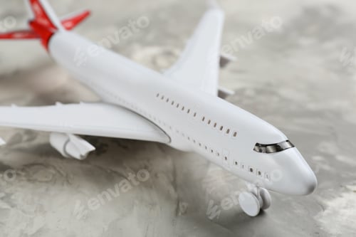 Preview: Toy airplane on grey background, closeup view