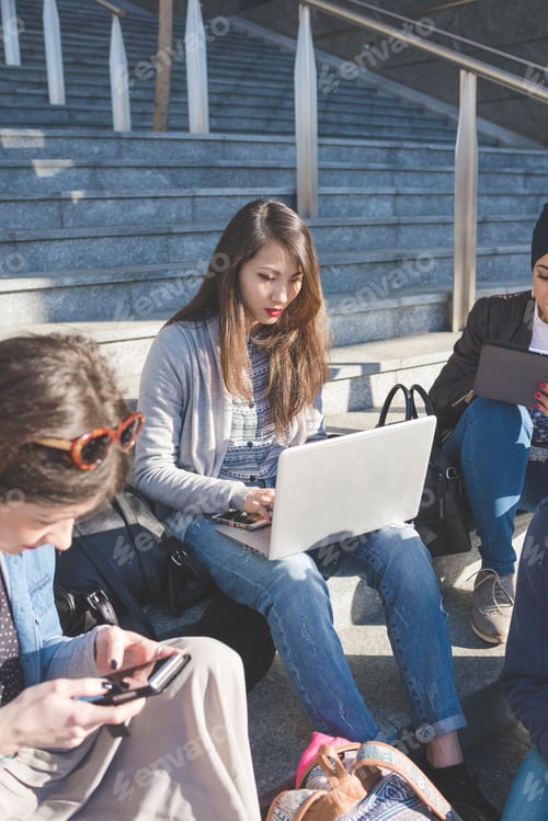 Preview: Multiracial group young people using technology
