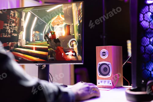Preview: Man in apartment at night using stereo speaker, playing games