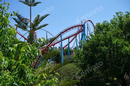 Preview: Inverted roller coaster with narrow metal rails, an ideal summer day to enjoy vacations