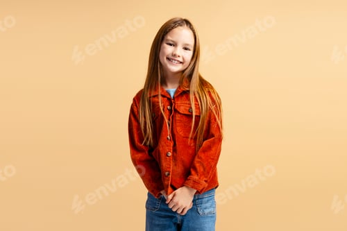 Preview: Portrait of beautiful smiling little girl wearing brown jacket looking at camera posing