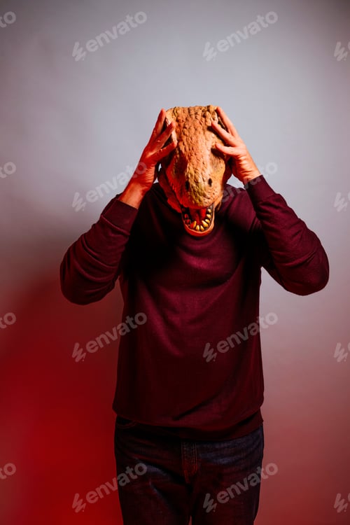 Preview: Man with lizard head in the studio.