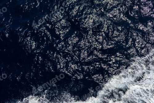 Preview: Beautiful blue sea water background with waves from the cruise ship. selective focus