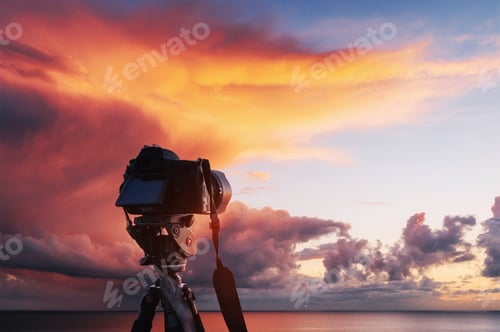 Preview: Sunset over the sea, the coast. West fireball of the sun above the horizon