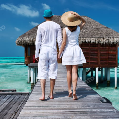Preview: Couple On A Tropical Beach Jetty At Maldives