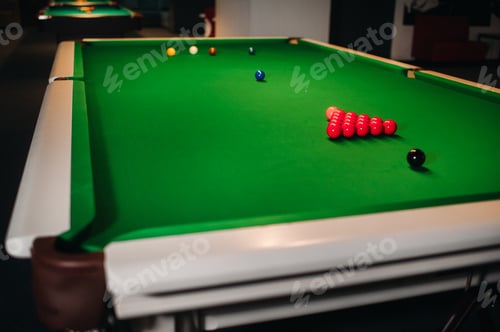 Preview: placing snooker balls on a green billiard table