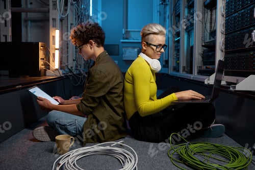 Preview: Young IT specialist team working in modern data center office