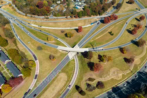 Preview: American freeway intersection with fast driving cars and trucks.