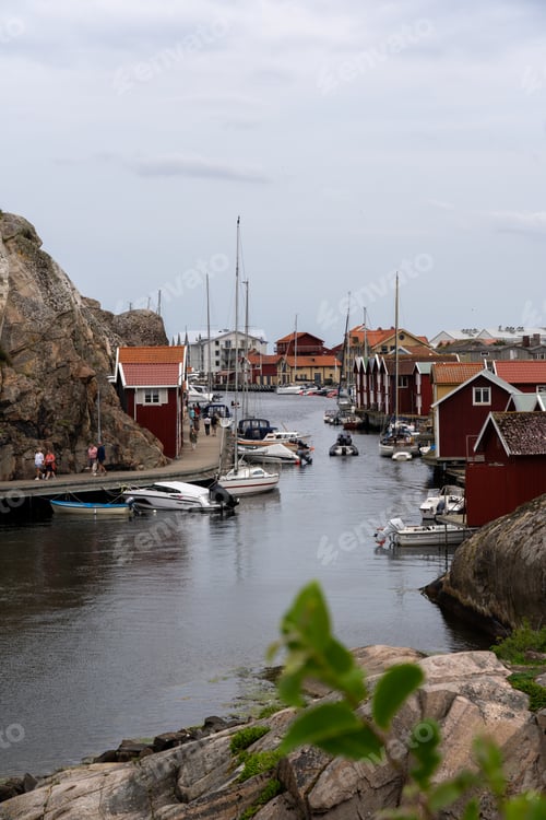 Preview: Scenic image captures a tranquil harbor with colorful fishing boats in Munkkyrkan, Smoegen, Sweden