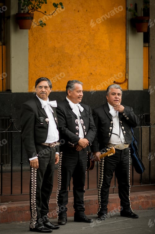 Preview: Three mariachi musicians waiting for their next performance.