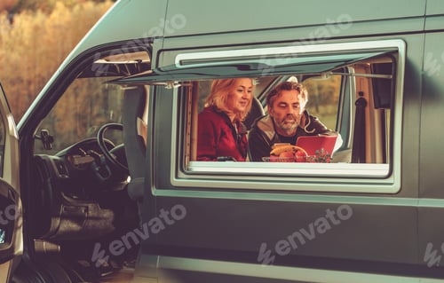 Preview: Couple Watching Movie Online Inside Their Camper Van