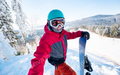 Preview: Snowboarder taking a selfie in the mountains