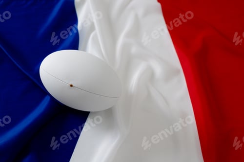 Preview: White rugby ball over flag of france