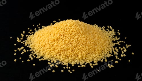 Preview: Heap of dry couscous isolated on black background