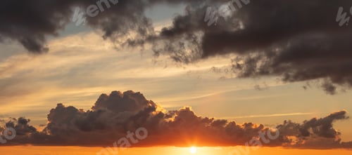 Preview: Panoramic shot of a beautiful sunset over a sea