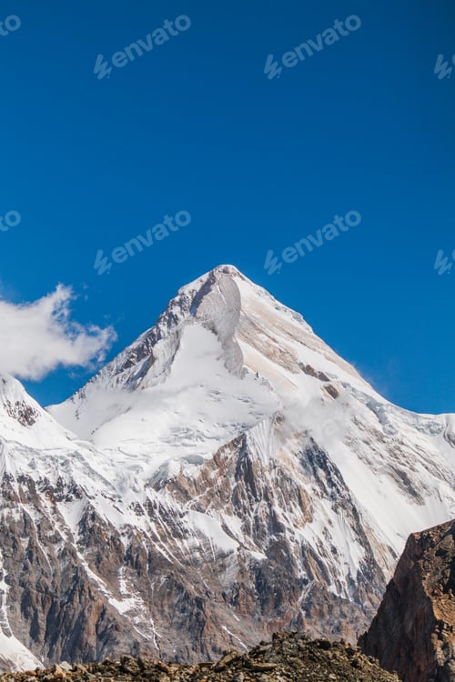 Preview: Majestic mountain peak under a clear blue sky