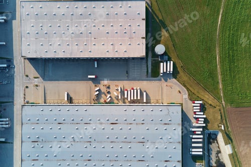 Preview: Factory warehouse with parked semi trucks, aerial view