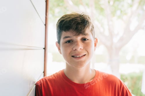 Preview: Smiling Teenager Posing in Front of White Siding