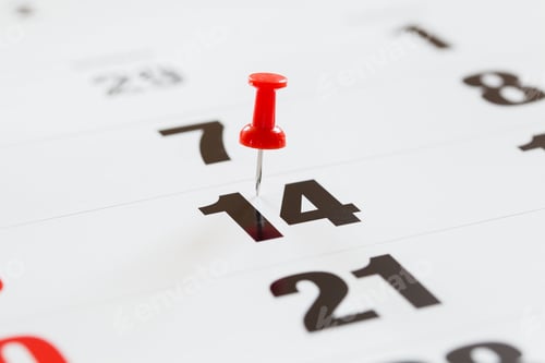 Preview: Pin pushed on a calendar concept for an important day.