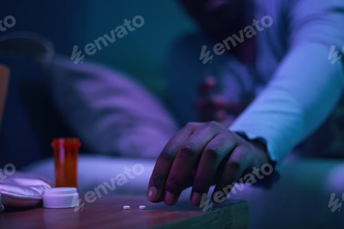 Preview: Reaching for Medication in a Dimly Lit Room