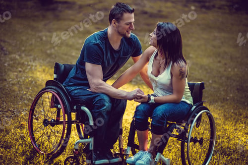 Preview: Handicapped young couple on two wheelchairs.