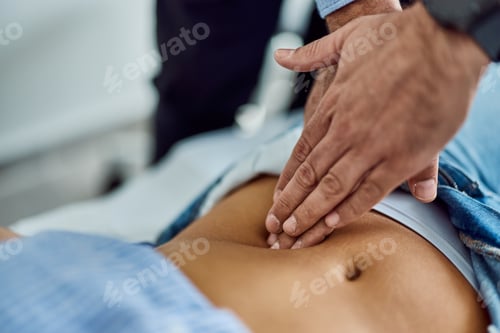 Preview: Doctor Performing Abdominal Examination on Patient During Medical Checkup Visit