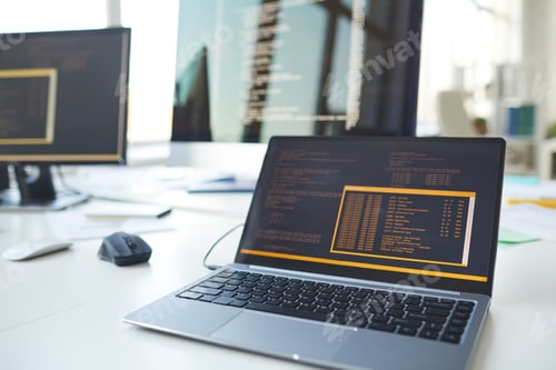 Preview: Computers with Code on Screen in IT Programmers Office