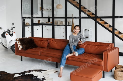 Preview: Attractive smiling young asian woman wearing casual clothes
