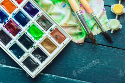 Preview: Watercolor Paints, Paint Brushes and Colorful Cloth