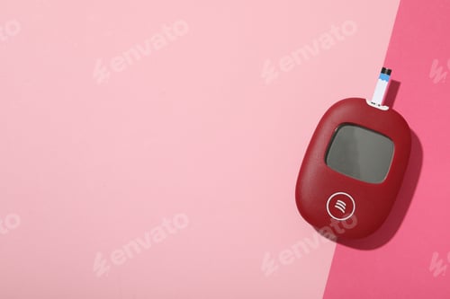 Preview: Red glucometer on pink background, space for text