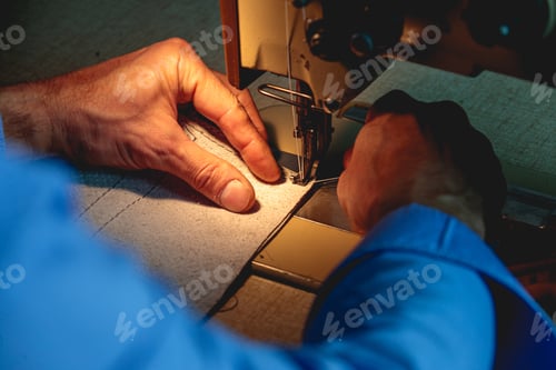 Preview: Closeup shot of a person doing handwork with a sewing machine