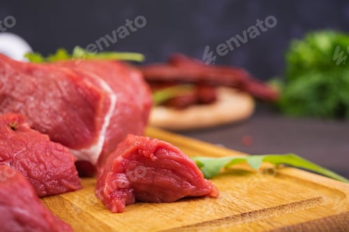 Preview: Raw meat. Fresh beef on wooden background