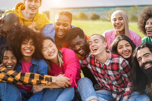 Preview: Young diverse people having fun outdoor laughing together - Focus on bald girl face