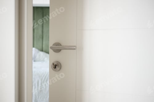 Preview: open door concept with Door handle and blur interior room background,