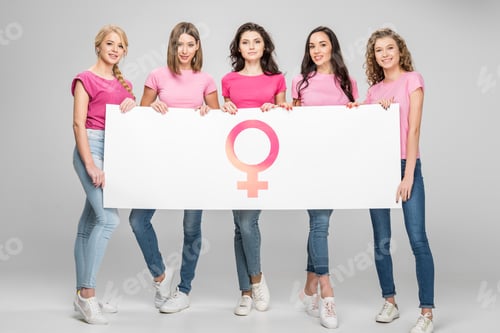 Preview: attractive girls holding large sign with female symbol on grey background