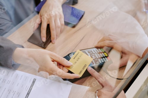 Preview: Processing Credit Card Payment at Checkout Counter