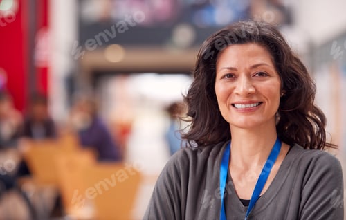Preview: Portrait Of Mature Female Teacher Or Student In College Hall