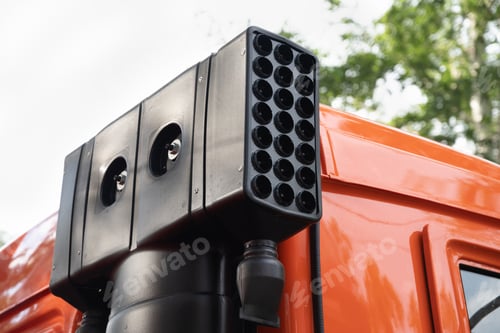 Preview: Close-up of a modern vehicle-mounted surveillance system on an orange truck.