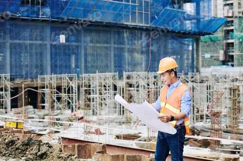 Preview: Construction engineer with blueprint