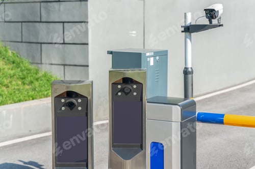 Preview: Closeup of an automatic parking lot identification system with a barrier arm