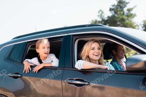 Preview: Selective focus of woman looking away during weekend on car with family