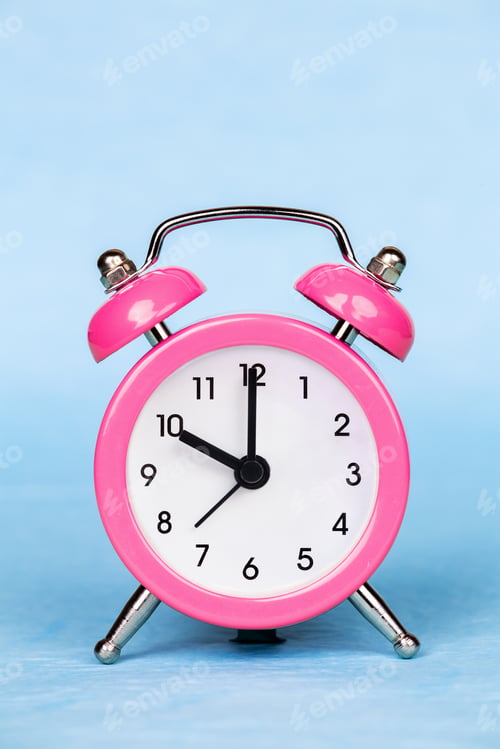 Preview: Alarm clock on a blue background, daylight savings time concept
