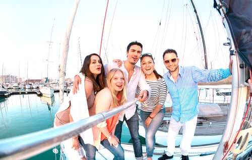 Preview: Friends group taking selfie pic with stick on luxury sailing boat party trip