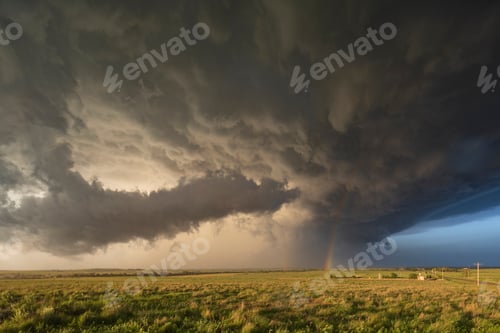 Preview: Back Side of a Tornado-Producing Supercell, black clouds, and blue sky