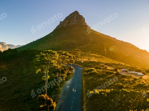 Preview: A couple of men and women watching the sunset at Lion's Head near Table Mountain Cape Town