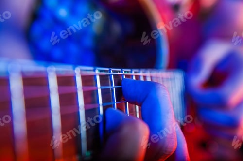 Preview: young male musician with a white guitar